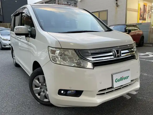 ホンダ ステップワゴン L 福岡県 2010(平22)年 12万km プレミアムホワイトパール 純正ナビ/（AM/FM/CD/DVD/USB/フルセグTV）/フリップダウンモニター/パーキングアシスト/純正フロアマット/ドライブレコーダー前（SD無し）/オートライト/フォグランプ/電格ミラー/取扱説明書/スペアキー×１