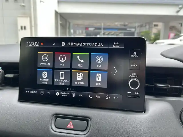 ホンダ ヴェゼル ハイブリッド e:HEV Z 長崎県 2023(令5)年 1.3万km メテオロイドグレーメタリック ワンオーナー/プッシュスタート/保証書/取扱説明書/スマートキー/渋滞追従機能付きアダプティブクルーズコントロール/Hondaコネクトディスプレイ(BT/AM/FM/フルセグ/ナビ)/USB入力端子/ETC2.0/ワイヤレス充電/バックカメラ/純正フロアマット/純正18インチアルミホイール/運転席・助手席シートヒーター/ABS/VSA(ビークルスタビリティアシスト)/LKAS(車線維持支援システム)/イモビライザーシステム/衝突軽減ブレーキ/前後ソナーセンサー/ヒルディセントコントロール/ドライブモードセレクト/パワーテールゲート/パドルシフト/オートライト/オートハイビーム