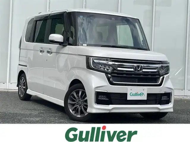 ホンダ Ｎ ＢＯＸ カスタム L 福岡県 2021(令3)年 3.2万km プラチナホワイトパール 社外carrozzeria7インチナビ/　（CD/DVD/SD/FM/AM/iPod/USB/ワンセグ/交通情報）/ホンダセンシング/　・横滑り防止装置/　・レーンキープアシスト/　・衝突軽減システム/　・クリアランスソナー/クルーズコントロール（追従走行有）/片側パワースライドドア/ETC/シートヒーター（運転席＋助手席）/オートライト/電格ミラー/ISOFIX/ECON/プッシュスタート/電格ミラー/純正マット