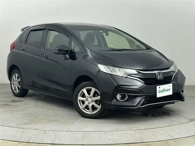 ホンダ フィット 13G S ホンダセンシング 道央・札幌 2018(平30)年 6.9万km クリスタルブラックパール ・４WD/・寒冷地仕様/・純正ナビゲーション(VXM-185VFi)/　CD/DVD/フルセグ/SD/iPod/USB/BT/・純正エンジンスターター/・バックカメラ/・ビルトインＥＴＣ/・社外ドラレコ前後/・ホンダセンシング/・レーダークルーズコントロール/・パドルシフト/・レーンキープアシスト/・横滑り防止装置/・衝突軽減ブレーキ/・純正フロアマット/・スマートキー/・プッシュスタート/・オートライト/・LEDヘッドライト/・フォグライト/・スペアキーあり/・純正ＡＷ15インチ＋夏タイヤ積込/・社外ＡＷ15インチ＋スタッドレス装着/・電動格納ウィンカーミラー/・ステアリングスイッチ/・ドアバイザー/・取説あり