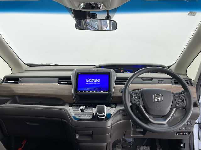 ホンダ フリード ハイブリット G ホンダセンシング 長野県 2021(令3)年 4.8万km プラチナホワイトパール 純正メモリナビ/Bluetooth/CD/DVD/フルセグTV/バックカメラ/ETC/コーナーセンサー/両側パワスラ/ステアリングスイッチ/先行車発進お知らせ/路外逸脱抑制/標識認識表示/横滑り防止装置/衝突被害軽減システム/レーンキープアシスト/LEDヘッドライト/スマートキー/ドアバイザー/純正フロアマット