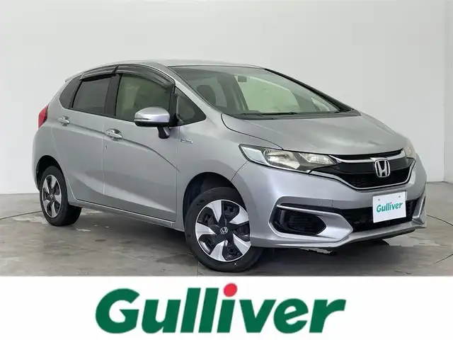 ホンダ フィット ハイブリット F 富山県 2018(平30)年 4.5万km ルナシルバーM 4WD/純正ナビ/（CD　DVD　FM　AM　Bluetooth）/フルセグテレビ/バックカメラ/横滑り防止システム/USB端子/HDMI端子/前方ドライブレコーダー/ステアリングスイッチ/スタッドレスタイヤ積込/純正フロアマット/純正ホイールキャップ/純正ドアバイザー/電動格納ミラー/スマートキー×2
