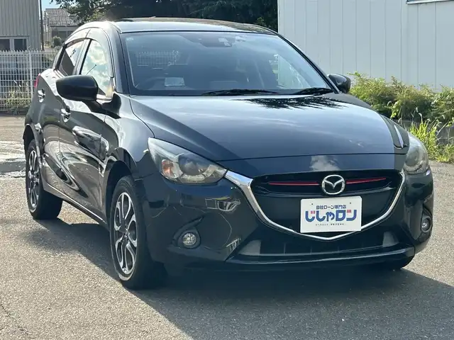 マツダ デミオ XD ツーリング 福島県 2015(平27)年 6.5万km ジェットブラックマイカ (株)IDOMが運営する【じしゃロン福島店】の自社ローン対象車両になります。こちらは現金ご利用時の価格です。自社ローンご希望の方は別途その旨お申付け下さい。/純正ナビ/バックカメラ/HUD/革巻きステアリング/クルーズコントロール/パドルシフト/フォグランプ/ドアバイザー/ステアリングリモコン/ドライブレコーダー/ウィンカーミラー/プッシュスタート/ETC