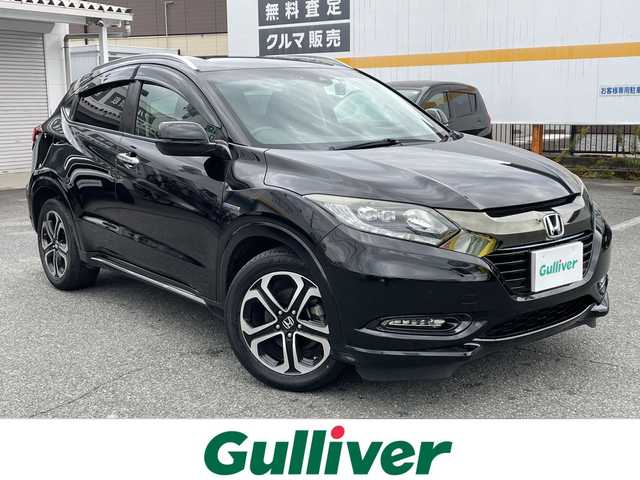 ホンダ ヴェゼル ハイブリッド Z ホンダセンシング 山口県 2017(平29)年 8.9万km クリスタルブラックパール 純正ナビ/DVD/CD/BT/USB/HDMI/フルセグTV/バックカメラ/ハーフレザーシート/前席シートヒーター/純正LEDヘッドライト/純正フォグランプ/オートライト/純正17インチアルミホイール/革巻きステアリング/ステアリングスイッチ/クルーズコントロール/パドルシフト/衝突被害軽減ブレーキ/LKA/横滑り防止/オートパーキングホールド/ルーフレール/スマートキー×２/ビルトインETC/ドライブレコーダー/純正フロアマット/純正ドアバイザー/電動格納ウインカードアミラー(オート機能付き)