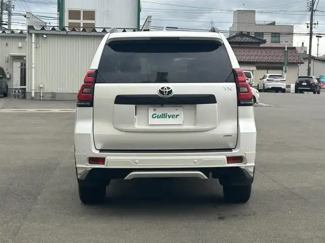 トヨタ ランドクルーザー プラド TX Lパッケージ マットブラED 山形県 2023(令5)年 2.5万km ホワイトパールクリスタルシャイン 4WD/衝突被害軽減システム/サンルーフ/モデリスタエアロ/純正メモリナビ/　　【CD DVD BT フルセグ USB】/全周囲カメラ/レーダークルーズコントロール/LEDオートライト/レザーシート/パワーシート/シートエアコン/シートヒーター/純正18インチアルミホイール/ドライブレコーダー/ステアリングスイッチ/MTモード付AT/電動格納ウィンカーミラー/フォグランプ/スマートキー/ETC2.0