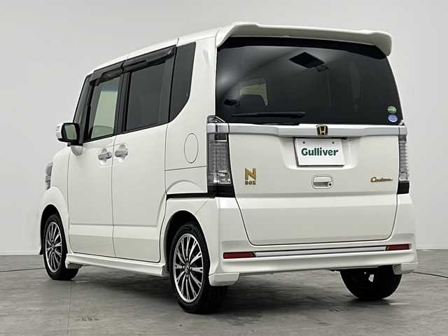 ホンダ Ｎ ＢＯＸ カスタム G ターボ Lパッケージ 三重県 2016(平28)年 6.4万km プレミアムホワイトパールⅡ 禁煙車/純正８型ナビ/（フルセグ・BT・DVD・USB・SD）/両側電動/Ｂカメラ/ビルトインＥＴＣ/クルコン　/ＣＴＢＡ/オートライト/ＨＩＤヘッド/ターボ/ステアリングリモコン/パドルシフト/プッシュスタート/スマートキー