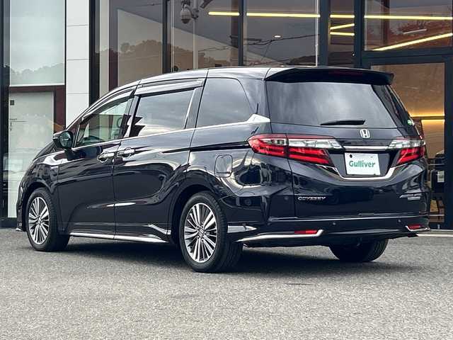 ホンダ オデッセイ ハイブリッド アブソルート・EXホンダセンジング 大阪府 2018(平30)年 6.8万km プレミアムヴィーナスブラックP 衝突軽減　両側パワースライドドア　Ｇａｔｈｅｒｓ９型ナビ　全方位カメラ　フルセグＴＶ　ＣＤ　ＤＶＤ　ＢＴ　ＨＤＭＩ　フリップダウンモニター　ハーフレザーシート　パワーシート　シートヒーター　ＢＳＭ 社外レーダー　AC100V　フォグランプ　後席サンシェード　2列目オットマン　電子パーキング　レーダークルーズコントロール　ETC2.0　スペアキー　純正フロアマット　純正アルミホイール　