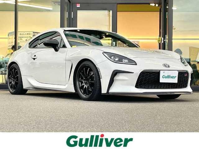 トヨタ ＧＲ８６ RZ 東京都 2022(令4)年 3.1万km クリスタルホワイトパール ＡＩＭＧＡＩＮ/・フロントカーボンスポイラー/・サイドカーボンスポイラー/GRトランクスポイラー/ＲＡＹＳホイール/ビルシュタイン車高調（ＫＷサスペンション）/HKS２本出しマフラー/ＡＬＰＩＮＥ９インチナビ（X9NXL）/バックカメラ/CD/DVD/BT/AM/FM/USB/HDMI/AppleCarplay/androidauto/ハーフレザーシート/シートヒーター/カロッツェリアウーファー（TS-WX140DA）/クルーズコントロール/LEDヘッドライト/ETC2.0/保証書・取説・スペアキー