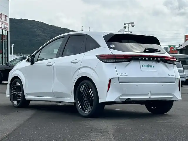 日産 オーラ G 鹿児島県 2024(令6)年 0.1万km ピュアホワイトパール 純正メモリナビ/　　BT/フルセグ/全方位カメラ/クルーズコントロール/LEDヘッドライト/ハーフレザーシート/純正17インチアルミホイール/ステアリングヒーター/純正ビルトインETC2.0/オートマチックハイビーム/スマートキー