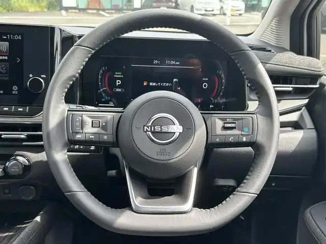 日産 オーラ G 鹿児島県 2024(令6)年 0.1万km ピュアホワイトパール 純正メモリナビ/　　BT/フルセグ/全方位カメラ/クルーズコントロール/LEDヘッドライト/ハーフレザーシート/純正17インチアルミホイール/ステアリングヒーター/純正ビルトインETC2.0/オートマチックハイビーム/スマートキー
