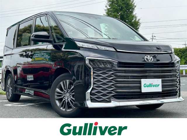 トヨタ ヴォクシー S－G 愛知県 2022(令4)年 1.4万km アティチュードブラックマイカ 純正メモリナビ/フルセグテレビ/バックカメラ/Bluetooth/フリップダウンモニター/ウィンカーミラー/クルーズコントロール/プッシュスタート/両側パワースライドドア/ビルトインETC2.0/レザーステアリング/衝突軽減ブレーキ/レーンキープ/サイドリフトアップチルシート