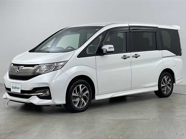 ホンダ ステップワゴン スパーダ クールスピリット 道央・札幌 2015(平27)年 4.4万km ホワイトオーキッドパール ・４WD＆ターボ/・寒冷地仕様/・純正ナビ（CD/DVD/BT/フルセグTV/USB）/・バックカメラ/・ハーフレザーシート/・前席シートヒーター/・ホンダセンシング/・両側パワースライドドア/・レーダークルーズコントロール/・パドルシフト/・ドアミラーヒーター/・LEDヘッドライト/・ステアリングスイッチ/・E T C/・社外ヘッドレストモニター/・コーナーセンサー/・アイドリングストップ/・社外AW付冬タイヤ積込