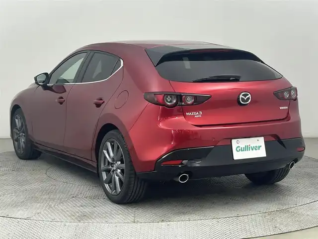 マツダ マツダ３ファストバック 15S ツーリング 道央・札幌 2020(令2)年 3.1万km ソウルレッドクリスタルM ・4WD/・純正SDナビゲーション/　CD/DVD/HDD/HDMI/フルセグ/USB/・i-ACTIVESENSE/・ビルトインETC/・社外ドライブレコーダー前後（ZRR-０１６）/・レーダークルーズコントロール/・横滑り防止装置/・前後コーナーセンサー/・オートライト/・オートマチックハイビーム/・オートブレーキホールド/・LEDヘッドライト/・MTモード付AT/・スマートキー/・プッシュスタート/・スペアキー１本/・純正フロアマット/・純正AW１８インチ/・電動格納ウィンカーミラー/・トノカバー/・取説あり