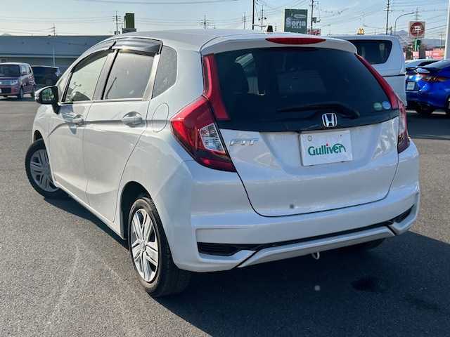 ホンダ フィット 13G L ホンダセンシング 岡山県 2019(平31)年 3.8万km パール 純正 SDナビ/(CD/DVD/BT/フルセグTV)/バックカメラ/衝突被害軽減システム/車線逸脱警報/クルーズコントロール/横滑り防止装置/ETC/ドライブレコーダー/アイドリングストップ/LEDヘッドライト/フォグランプ/オートライト/ウィンカーミラー/電動格納ミラー/純正アルミホイール/プッシュスタート/スマートキー/フロアマット/ドアバイザー