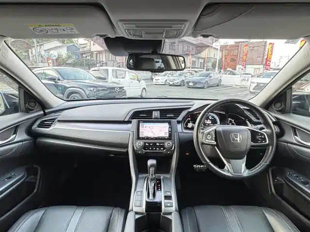 ホンダ シビック セダン 熊本県 2018(平30)年 4.8万km クリスタルブラックパール ワンオーナー/純正ナビ(VXM-185VFi)/【フルセグTV/Bluetooth/CD/DVD】/バックカメラ/クルーズコントロール/オートLEDライト/ブレーキホールド/ブラックレザーシート/前席シートヒーター/前席パワーシート/革巻きステアリング/ステアリングスイッチ/プッシュスタート/スマートキー/ETC/純正フロアマット/ドアバイザー/横滑り防止装置/ABS/盗難防止装置