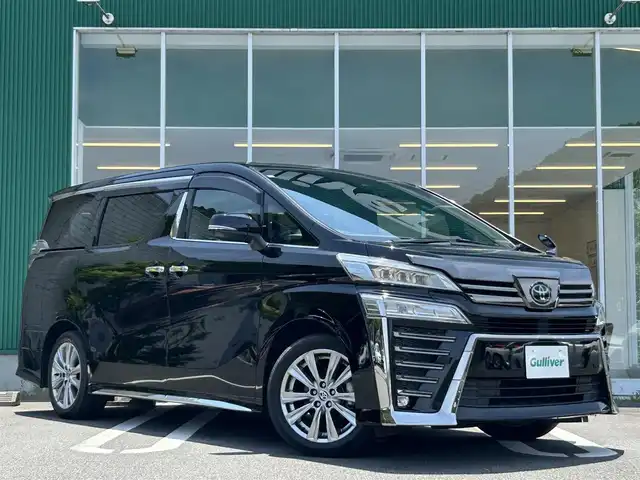 トヨタ ヴェルファイア Z ゴールデンアイズ 愛媛県 2020(令2)年 4.4万km ブラック ワンオーナー/純正9インチナビ/（AM/FM/BT）/バックカメラ/ドライブレコーダー/ビルドインETC/両側パワースライドドア/パワーバックドア/ハーフレザーシート/3列シート/衝突被害軽減システム/オートホールド付電子パーキング/レーダークルーズコントロール/コーナーセンサー/横滑り防止装置/純正LEDライト/オートライト/フォグランプ/純正18インチAW/社外フロアマット/ステアリングスイッチ/スマートキー/取扱説明書/保証書