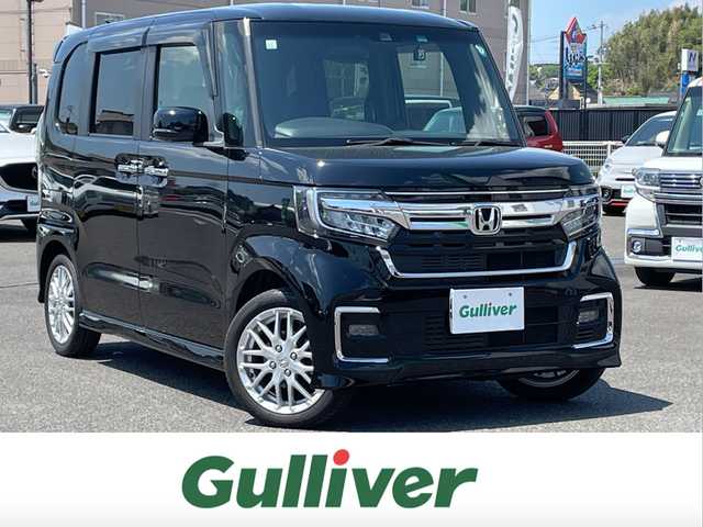 ホンダ Ｎ ＢＯＸ カスタム L ターボ 広島県 2021(令3)年 0.7万km クリスタルブラックパール 社外メモリナビ(CN-E330D)/(CD/BT/ワンセグ)/バックカメラ/両側パワースライドドア/ホンダセンシング/D/N席シートヒーター/純正AW15インチ/LEDヘッドライト/オートライト/ドラレコ/ETC/革巻きハンドル/ステアリングリモコン/スマートキー/オートリトラミラー/アレルクリーンプラスシート/プラズマクラスター搭載フルオート・エアコンディショナー/運転席＆助手席シートバックテーブル/プライムスムース＆トリコットコンビシート/保証書/取扱説明書/ナビ取説