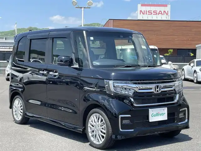 ホンダ Ｎ ＢＯＸ カスタム L ターボ 広島県 2021(令3)年 0.7万km クリスタルブラックパール 社外メモリナビ(CN-E330D)/(CD/BT/ワンセグ)/バックカメラ/両側パワースライドドア/ホンダセンシング/D/N席シートヒーター/純正AW15インチ/LEDヘッドライト/オートライト/ドラレコ/ETC/革巻きハンドル/ステアリングリモコン/スマートキー/オートリトラミラー/アレルクリーンプラスシート/プラズマクラスター搭載フルオート・エアコンディショナー/運転席＆助手席シートバックテーブル/プライムスムース＆トリコットコンビシート/保証書/取扱説明書/ナビ取説