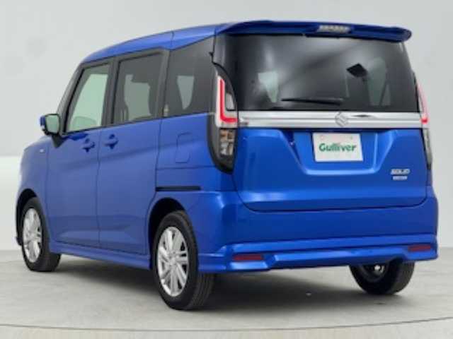 スズキ ソリオ HV MZ 熊本県 2024(令6)年 1.2万km スピーディーブルーM SUZUKIセーフティサポート/・デュアルセンサーブレーキサポート/・誤発進抑制機能（前後）/・低速時ブレーキサポート（前進/後退）/・パーキングセンサー/・車線逸脱警報機能/・車線逸脱抑制機能/・ふらつき警報機能/・発進お知らせ機能/・標識認識機能/・ハイビームアシスト/・ヘッドアップディスプレイ/・アダプティブクルーズコントロール/全方位モニター付き9型HDナビゲーション/・フルセグTV、CD/DVD、AM/FM、USB/・BT対応、AppleCarPlay、AndroidAuto/ステアリングスイッチ/両側電動スライドドア/スリムサーキュレーター/パーソナルテーブル/ロールサンシェード/前席シートヒーター/アイドリングストップ/横滑り防止装置/電動格納ミラー/純正フロアマット/オートライト/LEDヘッドライト/LEDフォグ/純正15インチアルミホイール