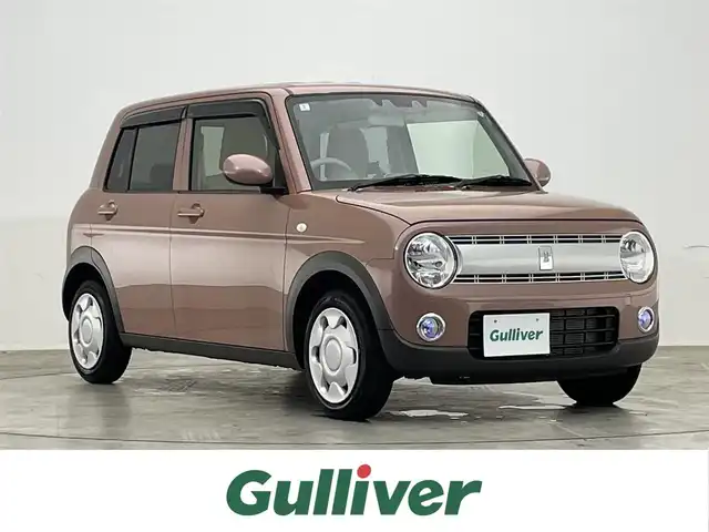 スズキ ラパン G 滋賀県 2024(令6)年 1万km テラコッタピンクメタリック 社外ナビ/(CD/DVD/フルセグ/Bluetooth)/バックカメラ/リアソナー/アイドリングストップ/シートヒーター(D席)/衝突軽減/横滑り防止/フォグランプ/スマートキー/スペアキー/プッシュスタート/純正ドアバイザー