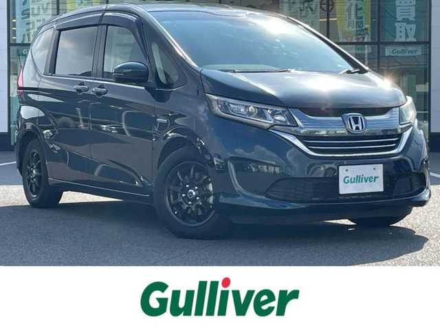 ホンダ フリード ハイブリット EX 岡山県 2019(平31)年 4.7万km フォレストグリーンパール 登録時走行距離47022km/純正ナビ/フルセグTV(AM/FM/CD/DVD/Bluetooth)/バックカメラ/両側パワースライドドア/ビルトインETC/ドライブレコーダー/デジタルインナーミラー/ホンダセンシング/・衝突軽減ブレーキ/・路外逸脱抑制機能/・アダプティブクルーズコントロール/・レーンキープアシスト/横滑り防止装置/D/N席シートヒーター/オートライト/15インチ社外AW/プッシュスタート/スマートキー