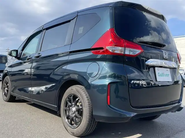 ホンダ フリード ハイブリット EX 岡山県 2019(平31)年 4.7万km フォレストグリーンパール 登録時走行距離47022km/純正ナビ/フルセグTV(AM/FM/CD/DVD/Bluetooth)/バックカメラ/両側パワースライドドア/ビルトインETC/ドライブレコーダー/デジタルインナーミラー/ホンダセンシング/・衝突軽減ブレーキ/・路外逸脱抑制機能/・アダプティブクルーズコントロール/・レーンキープアシスト/横滑り防止装置/D/N席シートヒーター/オートライト/15インチ社外AW/プッシュスタート/スマートキー