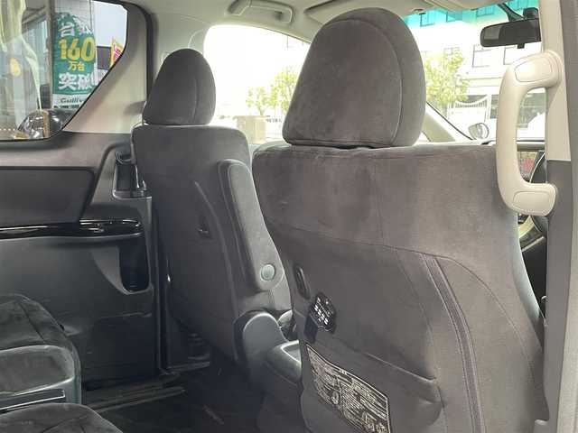 トヨタ ヴェルファイア 2．4Z プラチナセレⅡ ゴールド 岡山県 2011(平23)年 10.8万km ブラック 登録時走行距離107601km/フリップダウン後席モニター/社外SDナビ/(AM/FM/DISC/TV/BT)/クルーズコントロール/両側パワースライドドア/電動リアゲート/ビルトインETC/バックカメラ/ウォークスルー/MTモード付AT/プッシュスタート/スマートキー/スペアキー/純正１８インチアルミホイール/キセノンヘッドライト