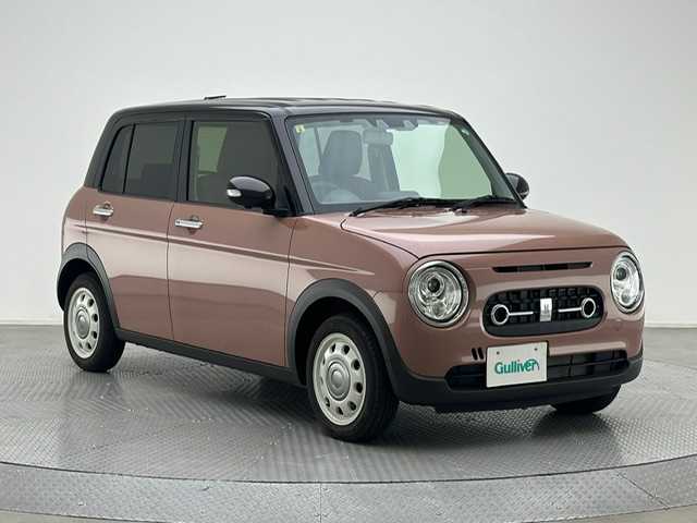 スズキ ラパン ＬＣ X 兵庫県 2023(令5)年 0.6万km テラコッタピンクメタリック/アーバンブラウン 2トーン ・全方位モニター用カメラパッケージ/・コーナーセンサー/・レーンキープアシスト/・アイドリングストップ/・オートライト/・LED ライト/・シートヒーター/・ハーフレザー/・スマートキー/・スペアキー×１/・純正１４インチAW