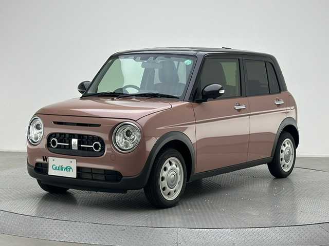 スズキ ラパン ＬＣ X 兵庫県 2023(令5)年 0.6万km テラコッタピンクメタリック/アーバンブラウン 2トーン ・全方位モニター用カメラパッケージ/・コーナーセンサー/・レーンキープアシスト/・アイドリングストップ/・オートライト/・LED ライト/・シートヒーター/・ハーフレザー/・スマートキー/・スペアキー×１/・純正１４インチAW