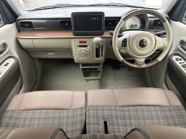 スズキ ラパン ＬＣ X 兵庫県 2023(令5)年 0.6万km テラコッタピンクメタリック/アーバンブラウン 2トーン ・全方位モニター用カメラパッケージ/・コーナーセンサー/・レーンキープアシスト/・アイドリングストップ/・オートライト/・LED ライト/・シートヒーター/・ハーフレザー/・スマートキー/・スペアキー×１/・純正１４インチAW