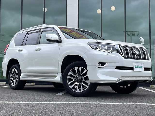 トヨタ ランドクルーザー プラド TX Lパッケージ 福岡県 2023(令5)年 2.9万km ホワイトパールクリスタルシャイン ・ワンオーナー/・純正エアロパーツ/・サンルーフ/・ブラックレザーシート/・アルパイン製９型ナビ/・アルパイン製デジタルインナーミラー/・アルパイン製ドライブレコーダー/・純正オプションウッドコンビハンドル/・純正オプションウッドコンビシフトノブ/・ウッド調パネル/・バックカメラ/・７人乗り/・シートヒーター/・エアシート/・パワーシート/・純正１９インチアルミホイル/・ルーフレール/・ドアバイザー/・フロアマット/・スマートキー/・保証書/・取扱説明書