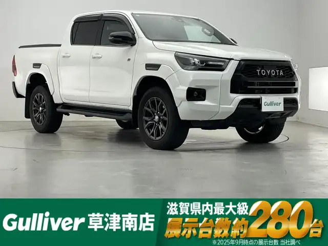 トヨタ ハイラックス Z GRスポーツ 滋賀県 2023(令5)年 2.7万km スーパーホワイトⅡ 純正8インチナビ/【Bluetooth/USB/Miracast】/バックカメラ/ハーフレザーシート/レーダークルーズコントロール/クリアランスソナー/レーンディパーチャーアラート/ヒルディセントコントロール/リアデフロック/LEDヘッドライト/オートライト/プリクラッシュセーフティ/前後ドライブレコーダー/ETC/MTモード付AT/プッシュスタート/スマートキー/ステアリングリモコン
