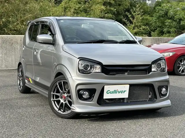 スズキ アルト ワークス 長崎県 2017(平29)年 4.2万km スチールシルバーM 社外SDナビ(Bluetooth/DISC/TV/FM/AM)/プッシュスタート/バックカメラ/スマートキー/オートライト/ビルトインETC/電動格納ミラー/保証書/取説/スペアキー/WORK16インチアルミホイール/FUJITSUBOマフラー(RIVID)/MONSTER SPORTエアロ(フロント/ウィンドウバイザー/GTウィング/サスペンション)/純正RECAROシート