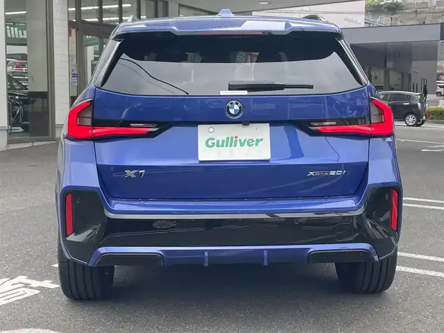 ＢＭＷ ＢＭＷ Ｘ１ 長崎県 2023(令5)年 1.3万km 青 ワンオーナー/車体色ポルティマオブルー(C31)/BMW　iDrive(BT/AM/FM/Spotify/AppleCarPlay/AndroidAuto/NAVI)/ルームミラー内蔵ETC/D+N席パワーシート/D+N席シートヒーター/エアシート/ヘッドアップディスプレイ/革巻きステアリング/ステアリングヒーター/ステアリングスイッチ/追従有りクルーズコントロール/ターボチャージャー搭載車/Assisted Drive Mode/ABS/ダイナミックスタビリティコントロール/アダプティブヘッドライト/レーンチェンジアシスト/アラームシステム/オートライトコントロール/ハイビームアシスト/ヒルディセントコントロール/アダプティブブレーキアシスタント/強化走行ダイナミクス/パークアシスト/制限速度アシスト/スペアキー(スマートキー1本)/カードキー/純正フロアマット/純正19インチアルミホイール/車両/ETC取扱説明書/保証書