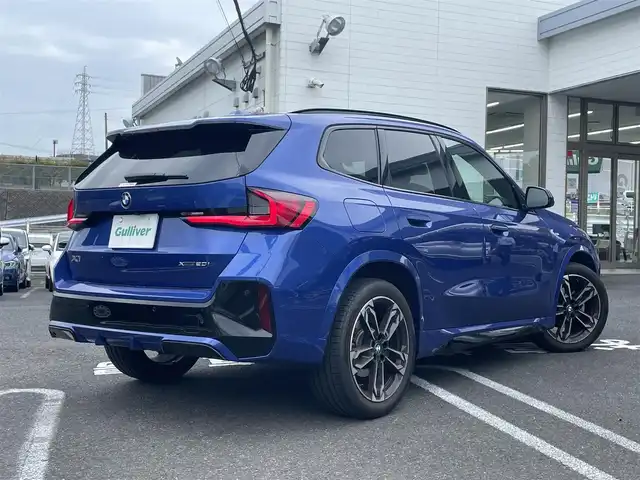 ＢＭＷ ＢＭＷ Ｘ１ 長崎県 2023(令5)年 1.3万km 青 ワンオーナー/車体色ポルティマオブルー(C31)/BMW　iDrive(BT/AM/FM/Spotify/AppleCarPlay/AndroidAuto/NAVI)/ルームミラー内蔵ETC/D+N席パワーシート/D+N席シートヒーター/エアシート/ヘッドアップディスプレイ/革巻きステアリング/ステアリングヒーター/ステアリングスイッチ/追従有りクルーズコントロール/ターボチャージャー搭載車/Assisted Drive Mode/ABS/ダイナミックスタビリティコントロール/アダプティブヘッドライト/レーンチェンジアシスト/アラームシステム/オートライトコントロール/ハイビームアシスト/ヒルディセントコントロール/アダプティブブレーキアシスタント/強化走行ダイナミクス/パークアシスト/制限速度アシスト/スペアキー(スマートキー1本)/カードキー/純正フロアマット/純正19インチアルミホイール/車両/ETC取扱説明書/保証書