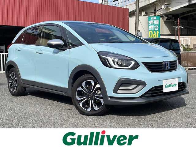 ホンダ フィット e:HEVクロスター 神奈川県 2022(令4)年 2.7万km サーフブルー ワンオーナー/純正メモリーナビ【VXM-225Ci】/・CD/ラジオ/USB/Bluetooth/バックカメラ/クリアランスソナー/ホンダセンシング/・衝突軽減ブレーキ/・踏み間違い衝突軽減システム/・歩行者事故低減ステアリング/・アダプティブクルーズコントロール/・車線維持支援システム/・路外逸脱抑制機能/・先行車発進お知らせ機能/・標識認識機能/ドライブレコーダー/ビルトインETC/純正16インチAW/純正LEDヘッドライト/ヘッドライトレベライザー/D席シートリフター/プッシュEgスタート/ストップ/スマートキー×2/ターンランプ付電動格納ドアミラー/純正フロアマット/取扱説明書/ナビ取扱説明書/新車時保証書