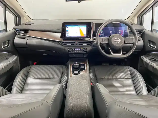 日産 オーラ G レザーエディション 岐阜県 2022(令4)年 1.5万km ピュアホワイトパール ブラインドスポットモニタ　/純正9インチナビ（フルセグ・Bluetooth・CD・DVD・USB）　全方位カメラ　/ドライブレコーダー　/デジタルインナーミラー　/ビルトインETC　/クリアランスソナー　/前席シートヒーター/純正フロアマット/ドアバイザー/ステアリングヒーター/純正17インチアルミホイール/スペアキー/保証書/取扱説明書/ナビ取扱説明書