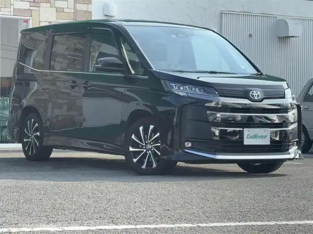 トヨタ ノア ハイブリッド S－Z 徳島県 2022(令4)年 3万km グリッターブラックガラスフレーク 10.5型純正ナビ/（HDMI/ラジオ/フルセグ/USB/BT/DISC）/バックカメラ/追従式クルーズコントロール/ビルトインETC2.0/オートブレーキホールド/前後コーナーセンサー/両側電動スライドドア/ドライブレコーダー/純正フロアマット/前席シートヒーター/前席エアーシート/ステアリングヒーター/DRIVEMODE/EVMODE/ハーフレザーシート/プッシュスタート/スマートキー/スペアキー