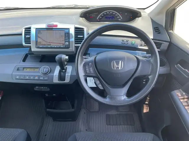 ホンダ フリード Gエアロ ジャストセレクション 鳥取県 2012(平24)年 5.6万km プレミアムブラキッシュパール ワンオーナー/純正ナビ／ＴＶ／ＤＶＤ／ＣＤ/バックカメラ/ビルトインＥＴＣ/純正エアロパーツ/片側パワースライド/スマートキー/キセノンライト/純正アルミホイール/ウィンカーミラー/電動格納ミラー/２列目キャプテンシート/フロアマット/ドアバイザー/スペアキーｘ１