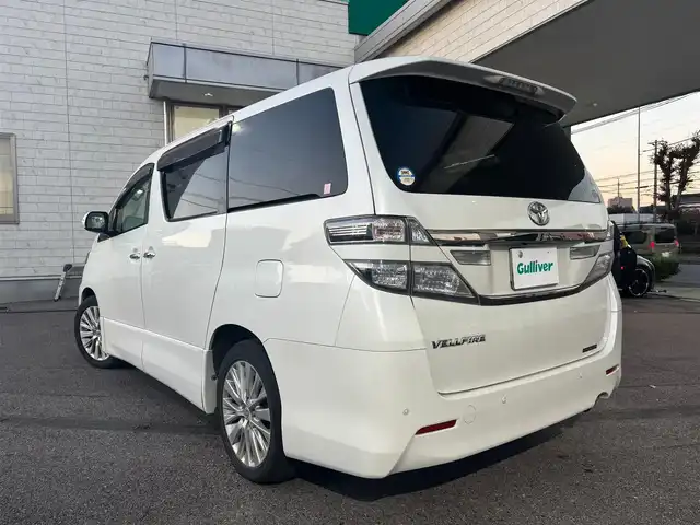 トヨタ ヴェルファイア 2．4Z Gエディション 愛知県 2013(平25)年 12.2万km ホワイトパールクリスタルシャイン ワンオーナー/4WD/両側パワースライドドア/純正フリップダウンモニター/純正HDDナビ(ワンセグ/BT/BD/DVD/CD/USB/ラジオ）/バックカメラ/ETC/クルーズコントロール/ABS/横滑り防止装置/盗難防止装置/オートライト/前後コーナーセンサー/シートポジションメモリー/レザーシート/パワーシート/シートヒーター/チップアップシート/オットマン/純正フロアマット/純正アルミホイール/パワーステアリング/パワーウィンドウ/ドアバイザー/フォグランプ/スマートキー/スペアキー/保証書/取扱説明書