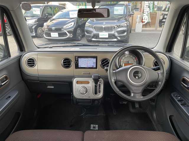 スズキ ラパン XL 岡山県 2013(平25)年 5.4万km アーバンブラウンパールメタリック 登録時走行距離53414km/社外SDナビ/(AM/FM/DISC/TV)/バックカメラ/D席シートヒーター/アイドリングストップ/プッシュスタート/スマートキー/純正14インチアルミホイール/パワーステアリング/パワーウィンドウ/保証書/記録簿/取扱説明書/ハロゲンヘッドライト