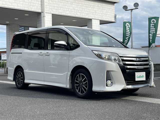 トヨタ ノア Si 岡山県 2014(平26)年 10.2万km ホワイトパールクリスタルシャイン 登録時走行距離101698km/フリップダウンモニター/社外SDナビ/(AM/FM/TV/DISC/BT/DS)/アイドリングストップ/バックカメラ/ビルトインETC/前後ドライブレコーダー/両側パワースライドドア/クルーズコントロール/F+Rエアロ/スマートキー/スペアキー×1/プッシュスタート/純正16インチアルミホイール/LEDヘッドライト