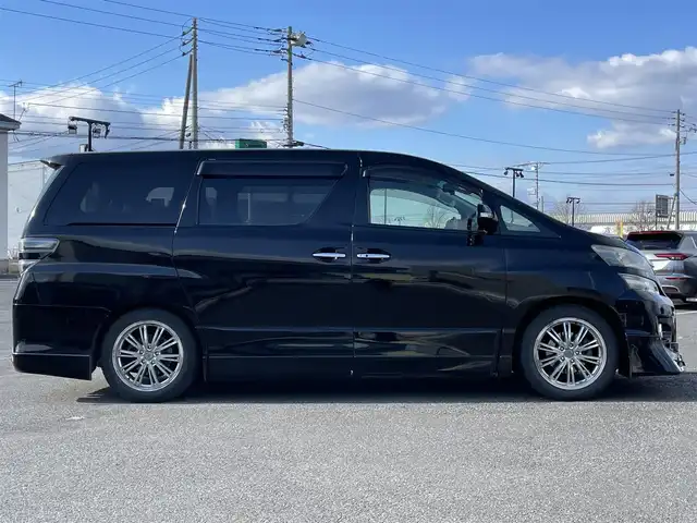 トヨタ ヴェルファイア 2．4Z Gエディション 道央・札幌 2012(平24)年 8.4万km ブラック ４WD/純正ディーラーOPナビ/CD/DVD/BT/フルセグ/純正フリップダウンモニター/横滑り防止装置/クルーズコントロール/クリアランスソナー/パーキングアシスト/センターデフロック/バックカメラ/ビルトインETC/ドライブレコーダー/ECOMODE/nanoe/両側パワースライドドア/パワーバックドア/前席/２列目パワーシート/D席メモリーシート/N席/２列目オットマン/革巻きウッドコンビステアリング/ステアリングリモコン/MTモード付AT/プッシュスタート/スマートキー/HIDヘッドライト/オートライト/フォグランプ/電動格納ミラー/ウィンカーミラー/純正フロアマット/ドアバイザー/スペアキー/社外エンジンスターター