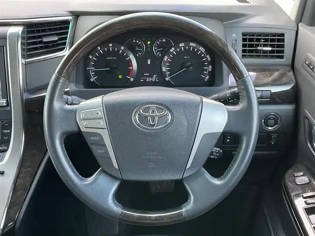 トヨタ ヴェルファイア 2．4Z Gエディション 道央・札幌 2012(平24)年 8.4万km ブラック ４WD/純正ディーラーOPナビ/CD/DVD/BT/フルセグ/純正フリップダウンモニター/横滑り防止装置/クルーズコントロール/クリアランスソナー/パーキングアシスト/センターデフロック/バックカメラ/ビルトインETC/ドライブレコーダー/ECOMODE/nanoe/両側パワースライドドア/パワーバックドア/前席/２列目パワーシート/D席メモリーシート/N席/２列目オットマン/革巻きウッドコンビステアリング/ステアリングリモコン/MTモード付AT/プッシュスタート/スマートキー/HIDヘッドライト/オートライト/フォグランプ/電動格納ミラー/ウィンカーミラー/純正フロアマット/ドアバイザー/スペアキー/社外エンジンスターター