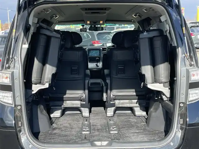 トヨタ ヴェルファイア 2．4Z Gエディション 道央・札幌 2012(平24)年 8.4万km ブラック ４WD/純正ディーラーOPナビ/CD/DVD/BT/フルセグ/純正フリップダウンモニター/横滑り防止装置/クルーズコントロール/クリアランスソナー/パーキングアシスト/センターデフロック/バックカメラ/ビルトインETC/ドライブレコーダー/ECOMODE/nanoe/両側パワースライドドア/パワーバックドア/前席/２列目パワーシート/D席メモリーシート/N席/２列目オットマン/革巻きウッドコンビステアリング/ステアリングリモコン/MTモード付AT/プッシュスタート/スマートキー/HIDヘッドライト/オートライト/フォグランプ/電動格納ミラー/ウィンカーミラー/純正フロアマット/ドアバイザー/スペアキー/社外エンジンスターター