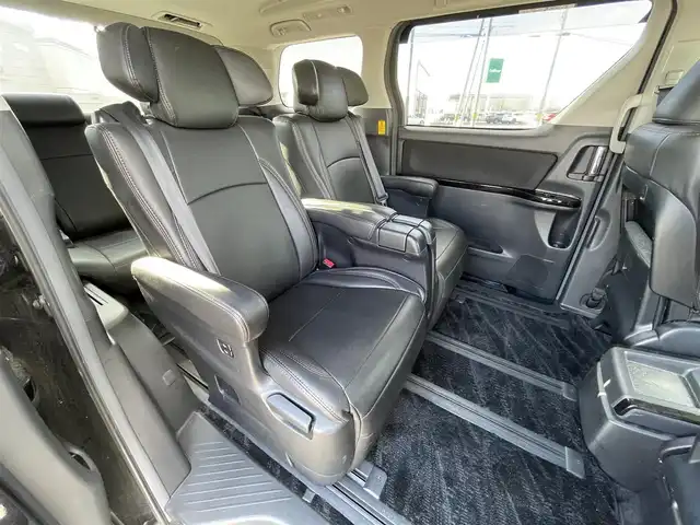 トヨタ ヴェルファイア 2．4Z Gエディション 道央・札幌 2012(平24)年 8.4万km ブラック ４WD/純正ディーラーOPナビ/CD/DVD/BT/フルセグ/純正フリップダウンモニター/横滑り防止装置/クルーズコントロール/クリアランスソナー/パーキングアシスト/センターデフロック/バックカメラ/ビルトインETC/ドライブレコーダー/ECOMODE/nanoe/両側パワースライドドア/パワーバックドア/前席/２列目パワーシート/D席メモリーシート/N席/２列目オットマン/革巻きウッドコンビステアリング/ステアリングリモコン/MTモード付AT/プッシュスタート/スマートキー/HIDヘッドライト/オートライト/フォグランプ/電動格納ミラー/ウィンカーミラー/純正フロアマット/ドアバイザー/スペアキー/社外エンジンスターター