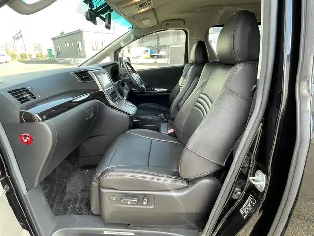 トヨタ ヴェルファイア 2．4Z Gエディション 道央・札幌 2012(平24)年 8.4万km ブラック ４WD/純正ディーラーOPナビ/CD/DVD/BT/フルセグ/純正フリップダウンモニター/横滑り防止装置/クルーズコントロール/クリアランスソナー/パーキングアシスト/センターデフロック/バックカメラ/ビルトインETC/ドライブレコーダー/ECOMODE/nanoe/両側パワースライドドア/パワーバックドア/前席/２列目パワーシート/D席メモリーシート/N席/２列目オットマン/革巻きウッドコンビステアリング/ステアリングリモコン/MTモード付AT/プッシュスタート/スマートキー/HIDヘッドライト/オートライト/フォグランプ/電動格納ミラー/ウィンカーミラー/純正フロアマット/ドアバイザー/スペアキー/社外エンジンスターター