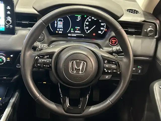 ホンダ ヴェゼル ハイブリッド e:HEV Z 埼玉県 2024(令6)年 0.4万km クリスタルブラックパール ホンダセンシング/純正9インチナビ/（Bluetooth/フルセグTV/USB）/バックカメラ/パワーバックドア/レーダークルーズコントロール/LEDヘッドライト/オートライト/ハーフレザーシート/D/N席シートヒーター/純正18インチアルミホイール/パドルシフト/ステアリングヒーター/ワイヤレス充電/ETC2.0