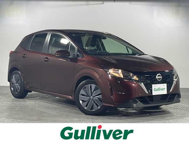 日産 ノート X 沖縄県 2023(令5)年 0.5万km バーガンディー 県外仕入　/禁煙車　/純正ディスプレイオーディオ　/Ｂｌｕｅｔｏｏｔｈ　/ＵＳＢ　/AｐｐｌｅＣａｒＰｌａｙ　/ＡｎｄｒｏｉｄＡｕｔｏ　/ステアリングリモコン　/エマージェンシーブレーキ　/コーナーセンサー