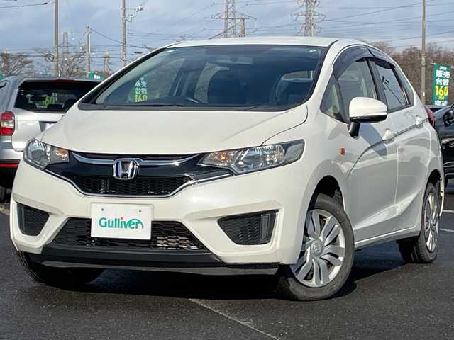 ホンダ フィット 13G 道央・札幌 2016(平28)年 8.4万km プレミアムホワイトパールⅡ ４WD/社外オーディオ/AM/FM/CD/AUX/横滑り防止装置/アイドリングストップ/ECON/リモコンキー/ハロゲンヘッドライト/ヘッドライトレベライザー/ウィンカーミラー/社外フロアマット/ドアバイザー/スチールホイール付冬タイヤ積込/185/60/R15/2023年/山5mm